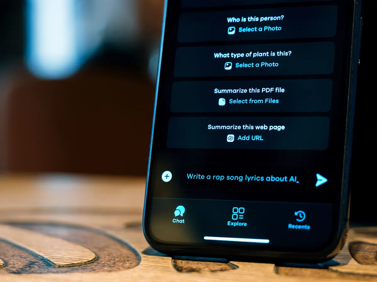 A smartphone showing an AI chat app on a table